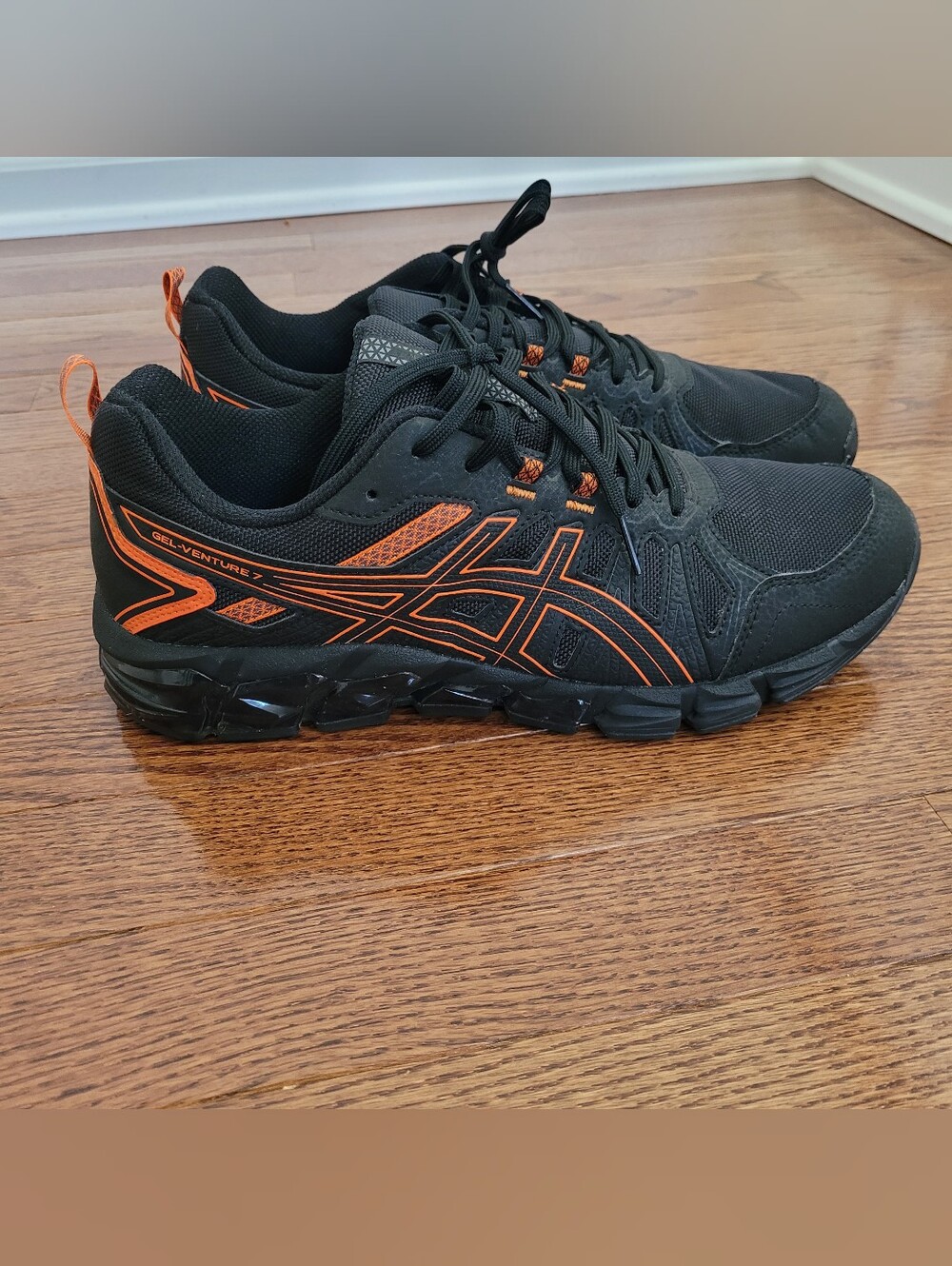 Asics Men's Black Athletic Trainers with Orange Detailing